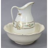 A late Victorian toilet jug & basin of white ground & with multicoloured floral banded decoration.