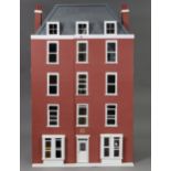 A modern brick-finish four-storey doll’s house, (fitted for electricity), with opening front, 30¼”