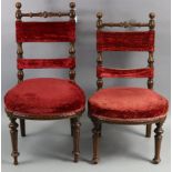 A pair of late 19th/early 20th century continental carved oak frame occasional chairs; together with