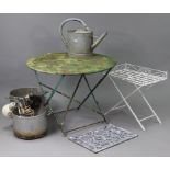 A green painted metal garden table with circular fold-away top, & on square legs, 37¾” diam. x