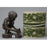 A bronzed composition ornament in the form of a kneeling boy holding a bucket, 11¾” high; & a