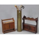 A brass shell-case umbrella stand, 28½” high; four various walking canes; & two small wall