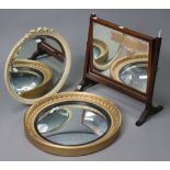 A gilt-frame convex wall mirror with ebonised inner slip, 18” diam.; a circular wall mirror in