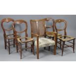 A mid-20th century beech frame elbow chair inset woven-cane panel to back, with padded seat, & on