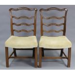 Two Chippendale-style mahogany dining chairs, each with shaped & pierced back, padded drop-in