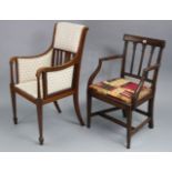 An Edwardian inlaid-mahogany-frame elbow chair with padded seat & back, & on square tapered