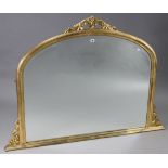 A reproduction gilt frame overmantel mirror with rounded top, 56¼” wide x 41” high.