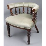 A late Victorian carved beech frame tub-shaped chair with padded seat & back, & on ring-turned