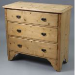 A pine small chest fitted three long graduated drawers with iron swing handles, 34” wide x 33½” high