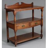 A late Victorian mahogany three-tier buffet or dumb waiter, with carved scroll pediment, fitted