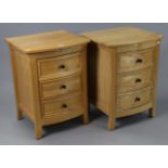 A pair of light-oak bow-front bedside chests each fitted three long drawers, 19¾” wide x 27” high