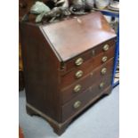 A 19th century mahogany bureau, the fall-front enclosing a fitted interior above an arrangement of