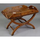 A reproduction walnut butler’s-tray coffee table on X-shaped supports with turned stretchers, 32”