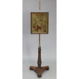 A late 19th century mahogany pole-banner screen inset embroidered panel depicting a lady in