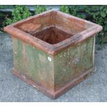 A terracotta planter of square form, 19½” wide x 16” high.