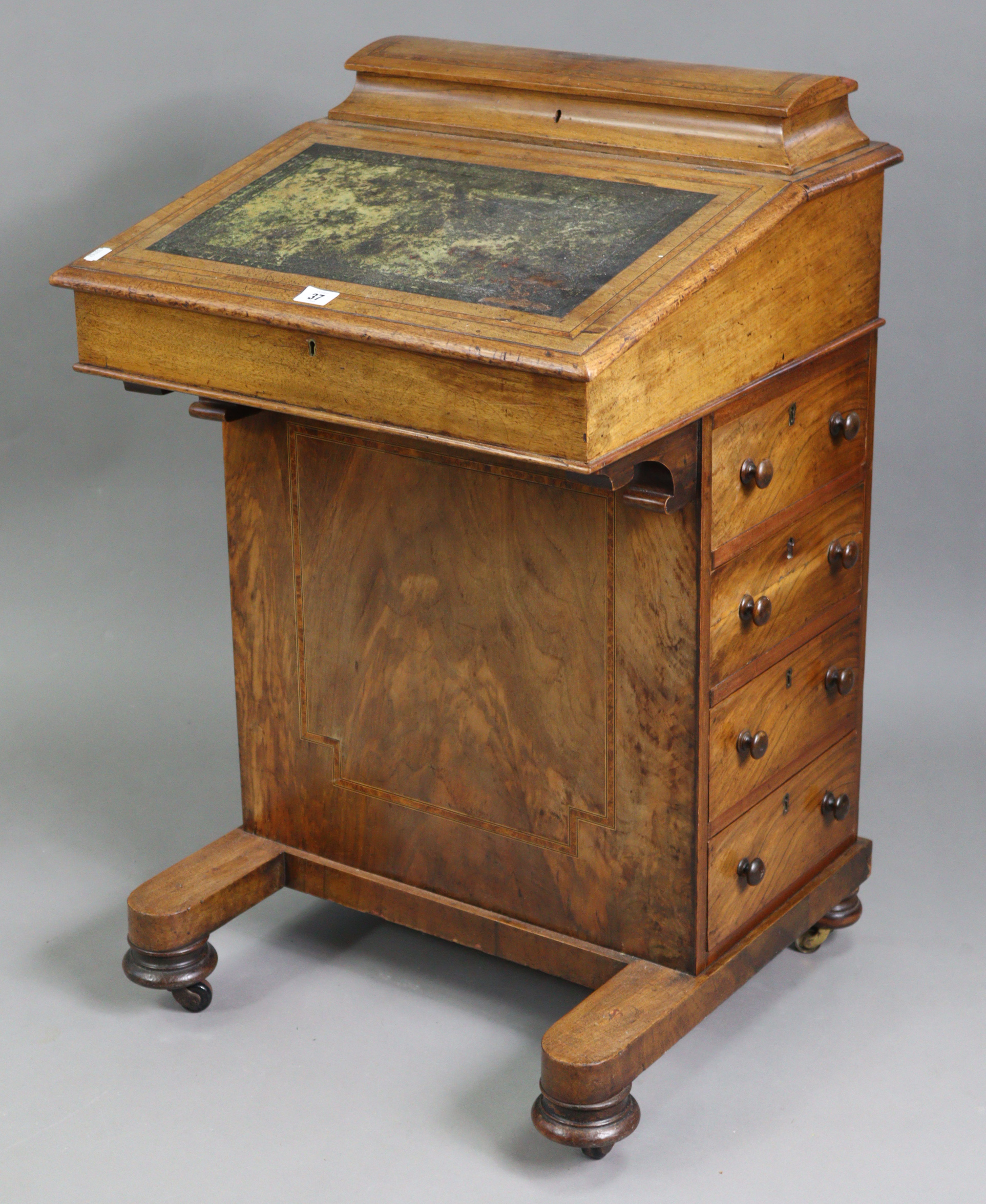 A Victorian inlaid-walnut davenport, inset gilt tooled leather to the hinged sloping front, fitted