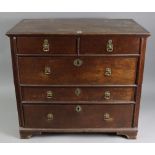 AN EARLY 18th CENTURY OAK CHEST, in two sections, fitted two short & three long graduated