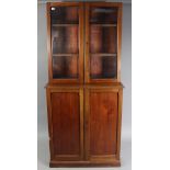 A Victorian mahogany tall bookcase (lacking cornice), the upper part with two adjustable shelves
