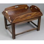 A mahogany butler’s-tray type rectangular low coffee table on moulded square legs with plain