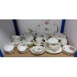 A Coalport bone china “Junetime” extensive fifty-nine piece part dinner & tea service.