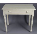 A white painted pine side table, fitted frieze drawer & on turned tapered legs, 33½” wide x 29½”