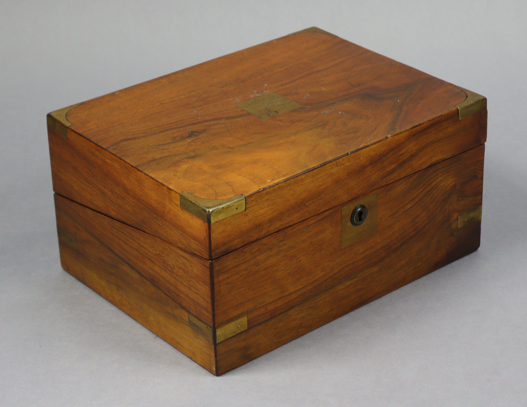 A 19th century rosewood writing slope having brass mounts, & with a fitted interior, 11½” wide.