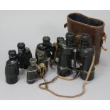 Four pairs of field glasses, one pair with case.
