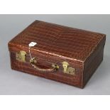 AN EARLY 20TH CENTURY ASPREY OF LONDON CROCODILE-SKIN SUITCASE with brass twin-lever