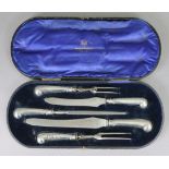 A set of five vintage silver-handled carvers by Goldsmiths & Silversmiths, cased.