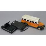 A vintage Hitachi "KK 1818" calculator, with case; & a reproduction tinplate model bus, 13¼" long.