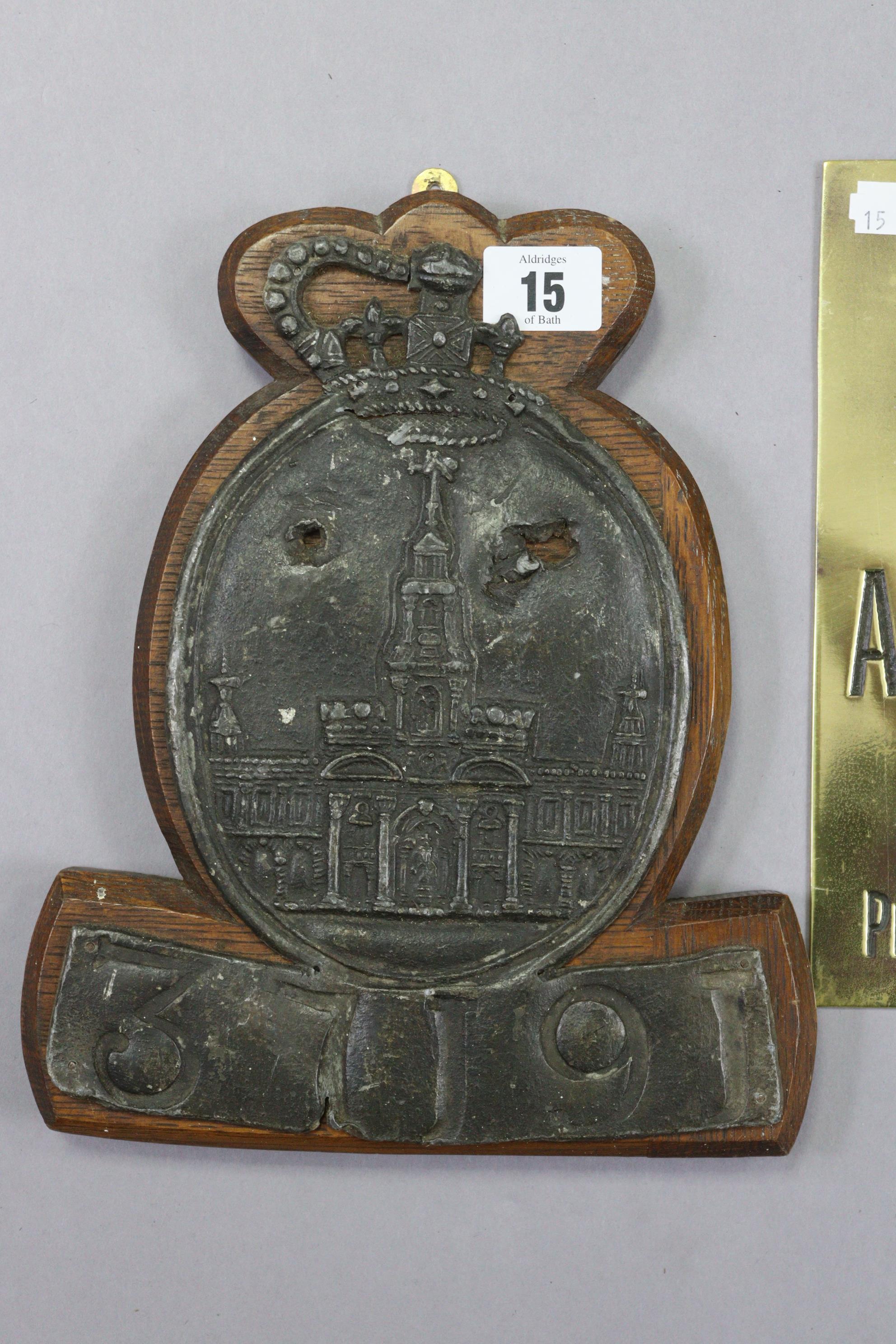 A late 18th century Royal Exchange lead fire mark (policy no. 37191) mounted on an oak plaque (10D - Image 3 of 3