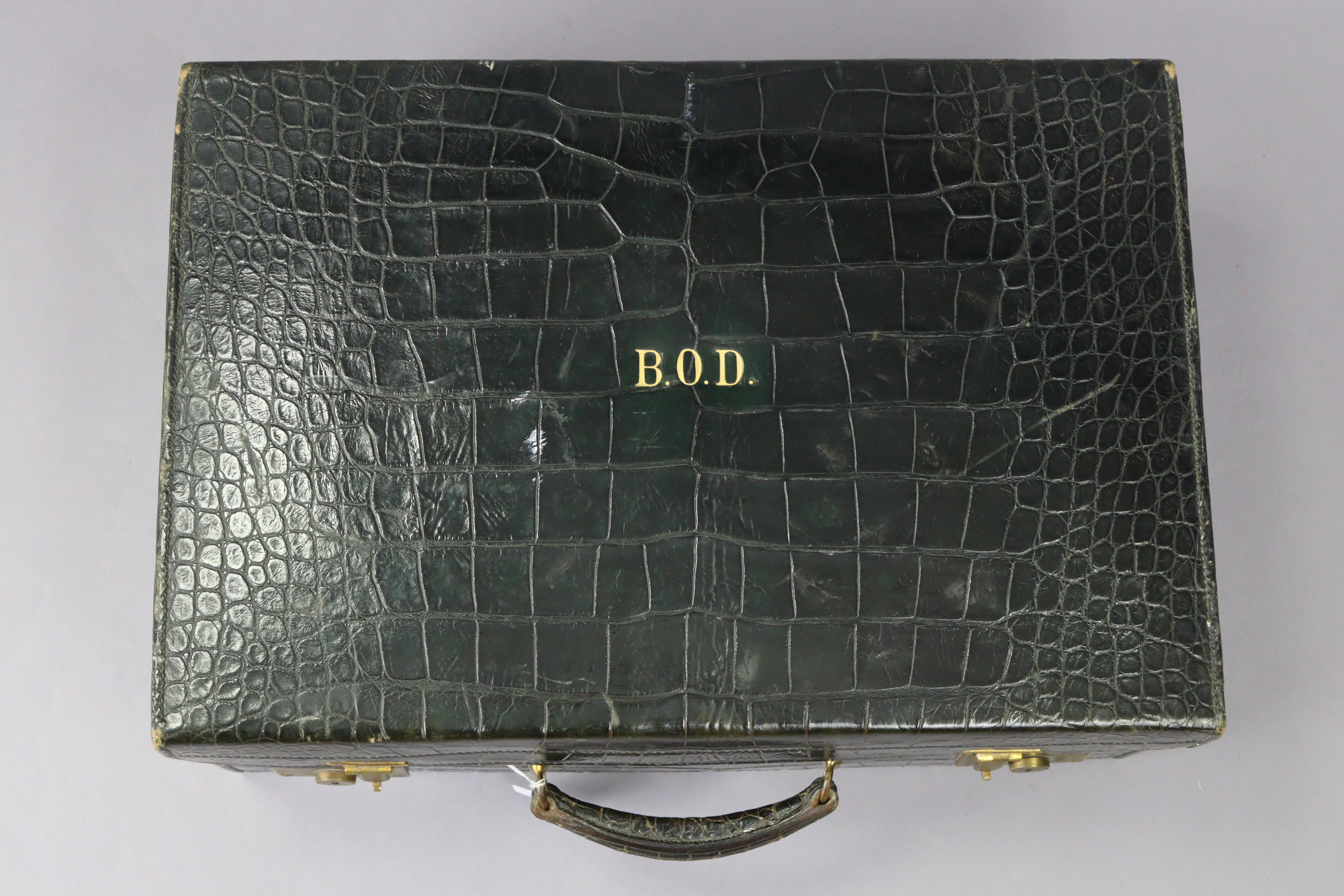 A late 19th/early 20th century dark green finish crocodile-skin suitcase with brass twin-lever - Image 2 of 5