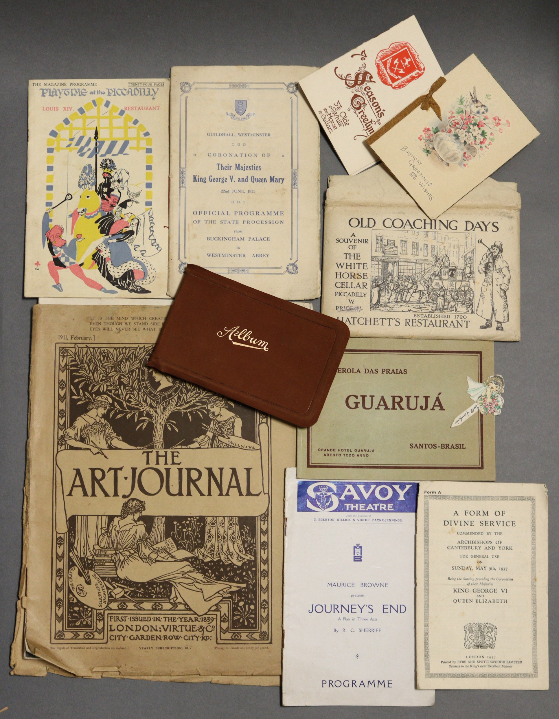 An Edwardian autograph album; together with ten various greetings cards; an official programme “