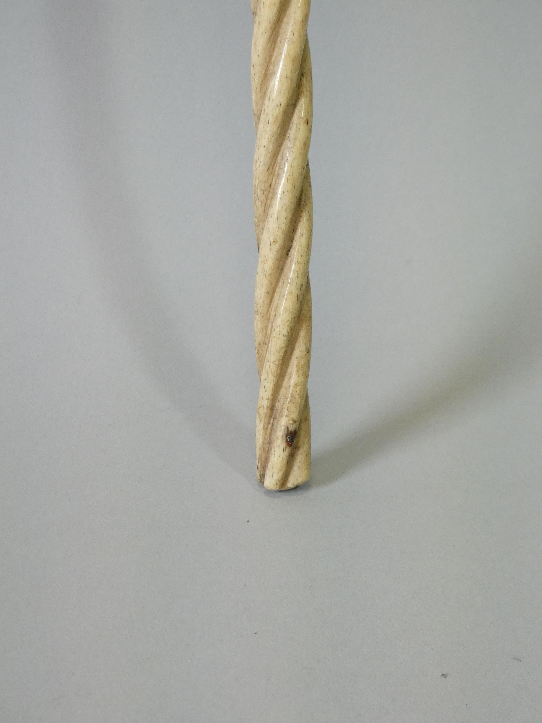 A 19th century whale jaw-bone & ivory-handled walking stick carved with a fist clutching a - Image 7 of 7