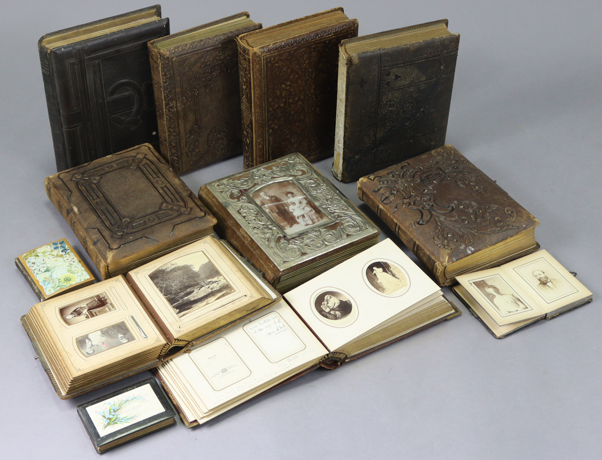 A large collection of assorted carte-de-visite portrait studies & family photographs, contained in