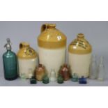 Three stoneware flagons; & thirteen various stoneware & glass bottles.