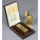 A Dunhill “No. 70” gold plated cigarette lighter, un-cased; & another Dunhill gold plated