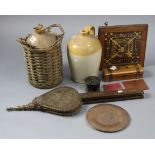 Two vintage stoneware flagons, one with a case, part w.a.f.; together with a pair of carved oak fire