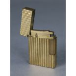 A Dupont gold plated cigarette lighter, cased.