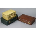 An early 20th century crocodile-skin suitcase with brass twin-lever locks, bears label "J. H.