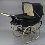 An early 20th century coach-built pram/perambulator (black) by Millson of London, with spoke wheels,