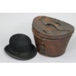 A vintage Woodrow's of London black felt bowler hat (size 7½"), with a leather hatbox.