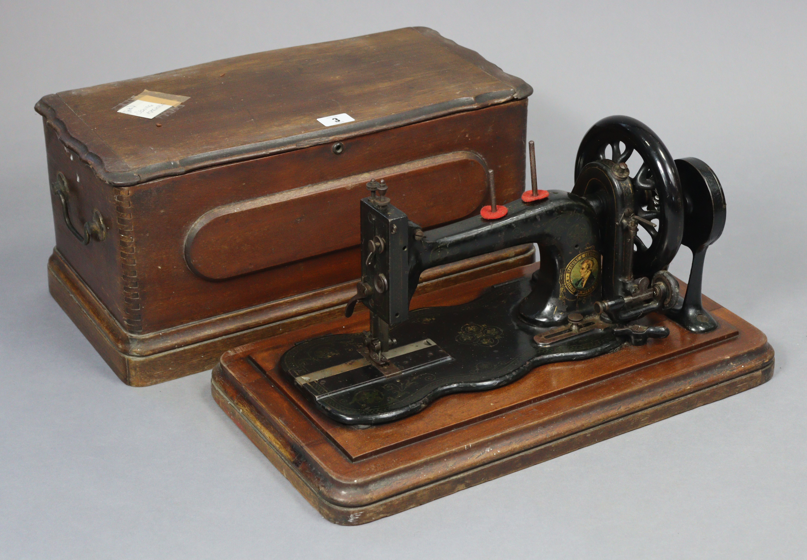 A vintage Bradbury & Company of Wellington Oldham sewing machine, with case.