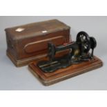 A vintage Bradbury & Company of Wellington Oldham sewing machine, with case.