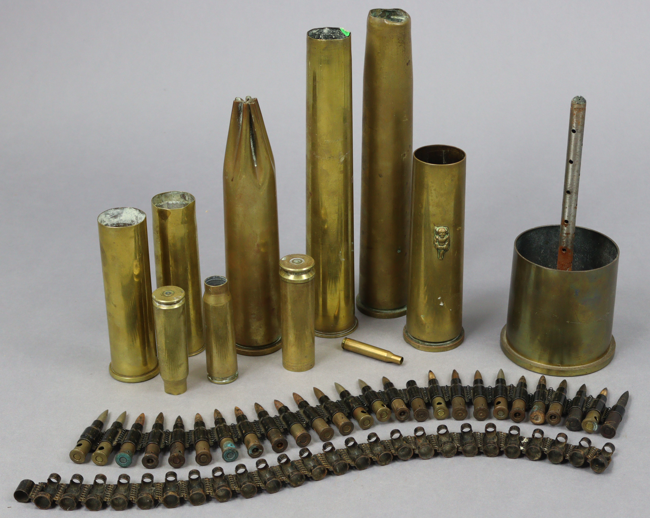A cartridge belt; & ten various shell cases.