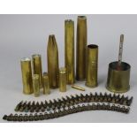 A cartridge belt; & ten various shell cases.