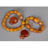 Two amber bracelets; & a pair of amber cuff-links. 43g total.