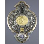 A large embossed silver-plated & gilt metal shield-shaped wall plaque inset enamelled plaque “LONDON