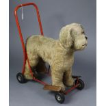 A mid-20th century Lines Brothers push-along dog baby walker.