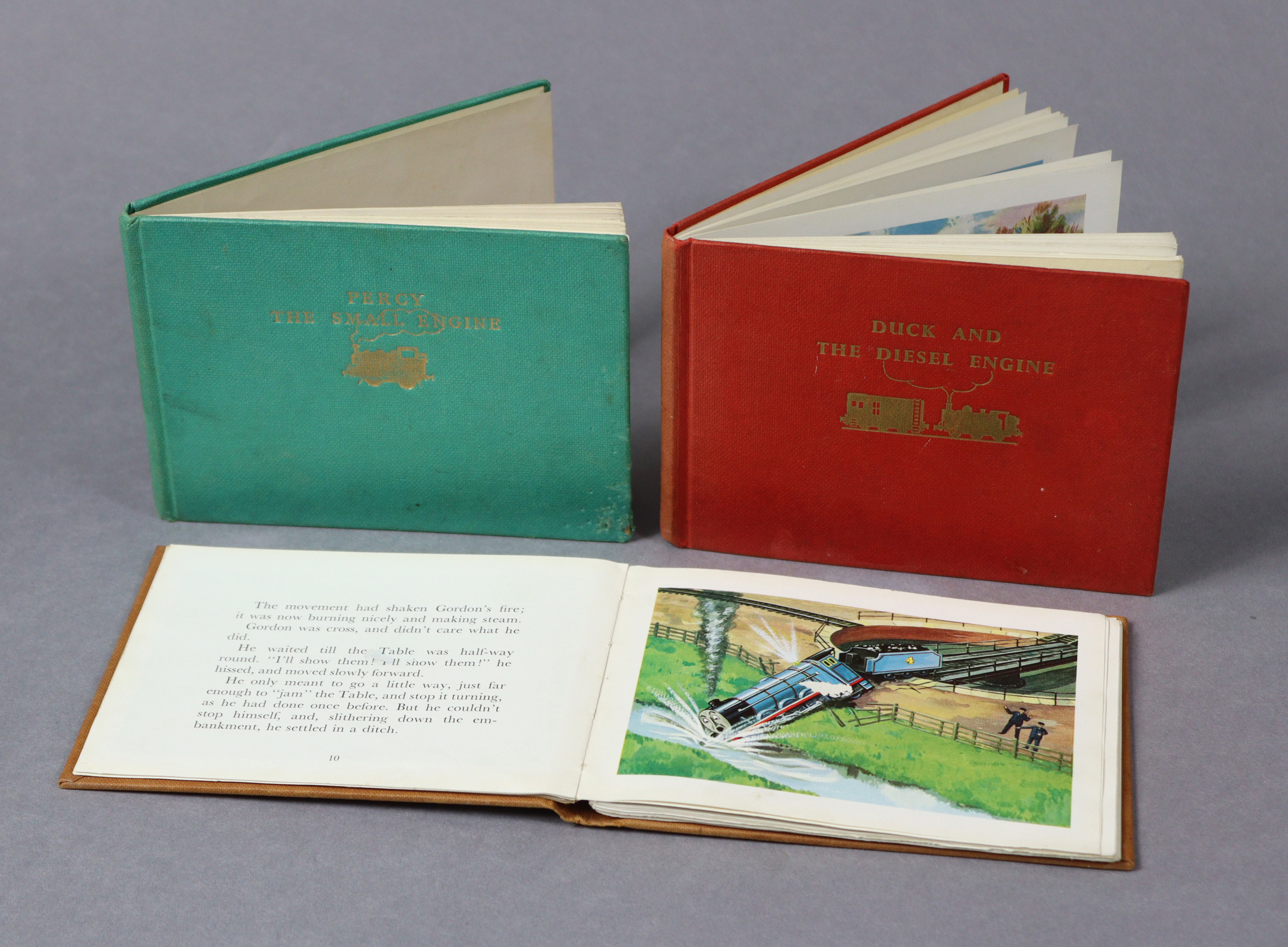 Three Railway Series volumes by the Rev. W. Awdry titled: “Duck And The Diesel Engine”, “Gordon